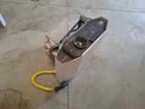 a machine that is sitting on the floor with a yellow hose