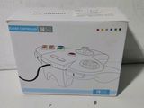 a box with a game controller in it sitting on a table