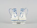 pair of blue and white vases on a grey background
