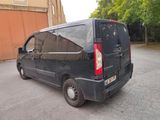 a black van that is parked in a parking lot