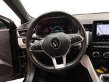 a picture of the interior of a car with a steering wheel and dashboard