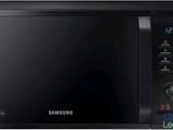 Le four à micro-ondes Samsung est noir et dispose d'un minuteur sur le côté.