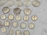 a lot of coins that are on a marble surface