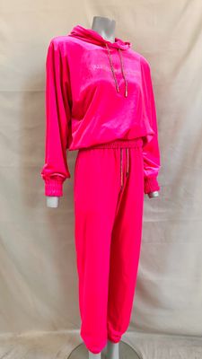 a mannequin mannequin wearing a bright pink outfit