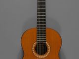 une vieille guitare en bois posée sur une surface grise