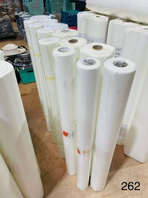 several rolls of white paper are stacked on top of each other