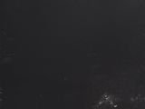 an old black chalkboard with a string attached to it