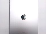 an apple ipad sitting on top of a white table next to a white wall