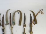 a lot of different types of knives on the table