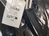 the back of a baseball jersey with a tag attached to it