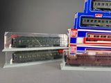 a lot of toy trains sitting on top of each other