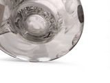 a clear glass with a circular design on it