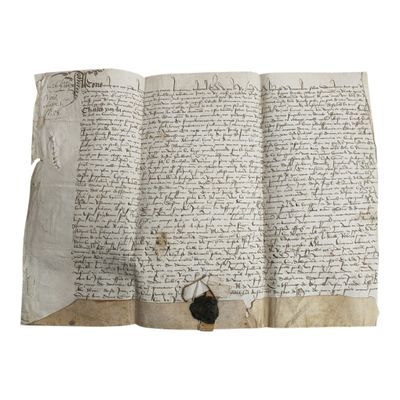 un ancien manuscrit comportant des inscriptions et muni d'un sceau de cire