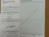 a picture of a receipt on a desk with a pen