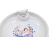 a small bowl with a little girl on it