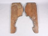 two pieces of wood that have been cut in half on a white surface