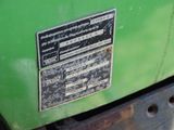 a close up of a green machine with a label on it