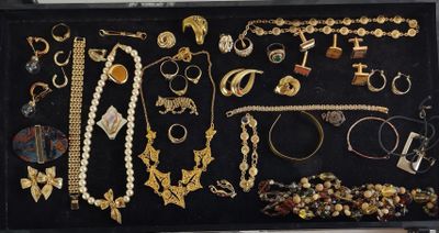 a black case with many different types of jewelry in it