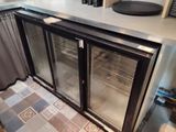 an image of a kitchen with a refrigerator and a counter top