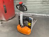 a forklift that is parked in front of a garage door