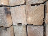 many pieces of wood stacked together in a pile