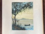 tableau représentant un homme dans un bateau sur un lac, dans un cadre