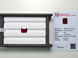 a red diamond in a black box next to a white card