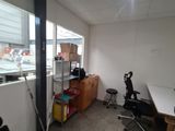 a room with a desk and a chair in it