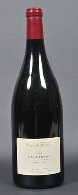 a bottle of wine sitting next to a bottle of wine