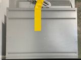 a metal box with a yellow ribbon on top of it
