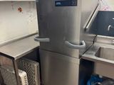 a kitchen with a sink and a dishwasher in it