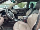 a view of the inside of a car from the driver ' s seat