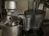 a blender and a mixer on a counter in a kitchen
