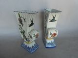two vases that have birds on them on them