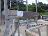 a picture of a large metal structure with a sign on it