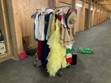 many clothes hanging on a rack in a room