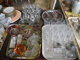 a lot of dishes and glasses on the table