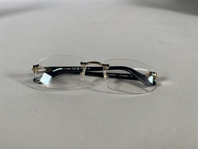 pair of glasses on a table with a white background