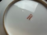 a white plate with a red writing on it