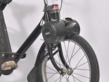 a black bicycle with a basket attached to it