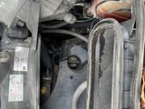 a picture of a car engine with its hood open