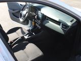 the interior of a car with the door open and the driver ' s seat down