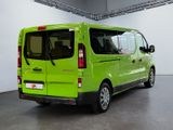 a green van that is parked inside of a building