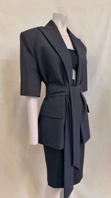 an image of a woman ' s dress and jacket on a mannequin mannequin