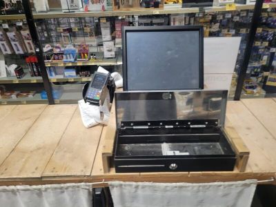 a laptop computer sitting on top of a table in a store