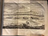 an old book with a drawing of a city on it