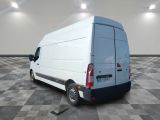 a white van that is parked on a checkered floor