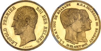 a gold sovereign coin with a profile of a woman ' s head
