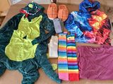 a cardboard box with a variety of clothing and accessories on it