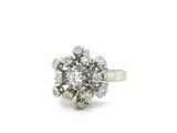 an image of a diamond cluster ring on a white background